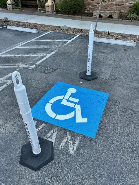 Reserved accessible stalls with posted signs