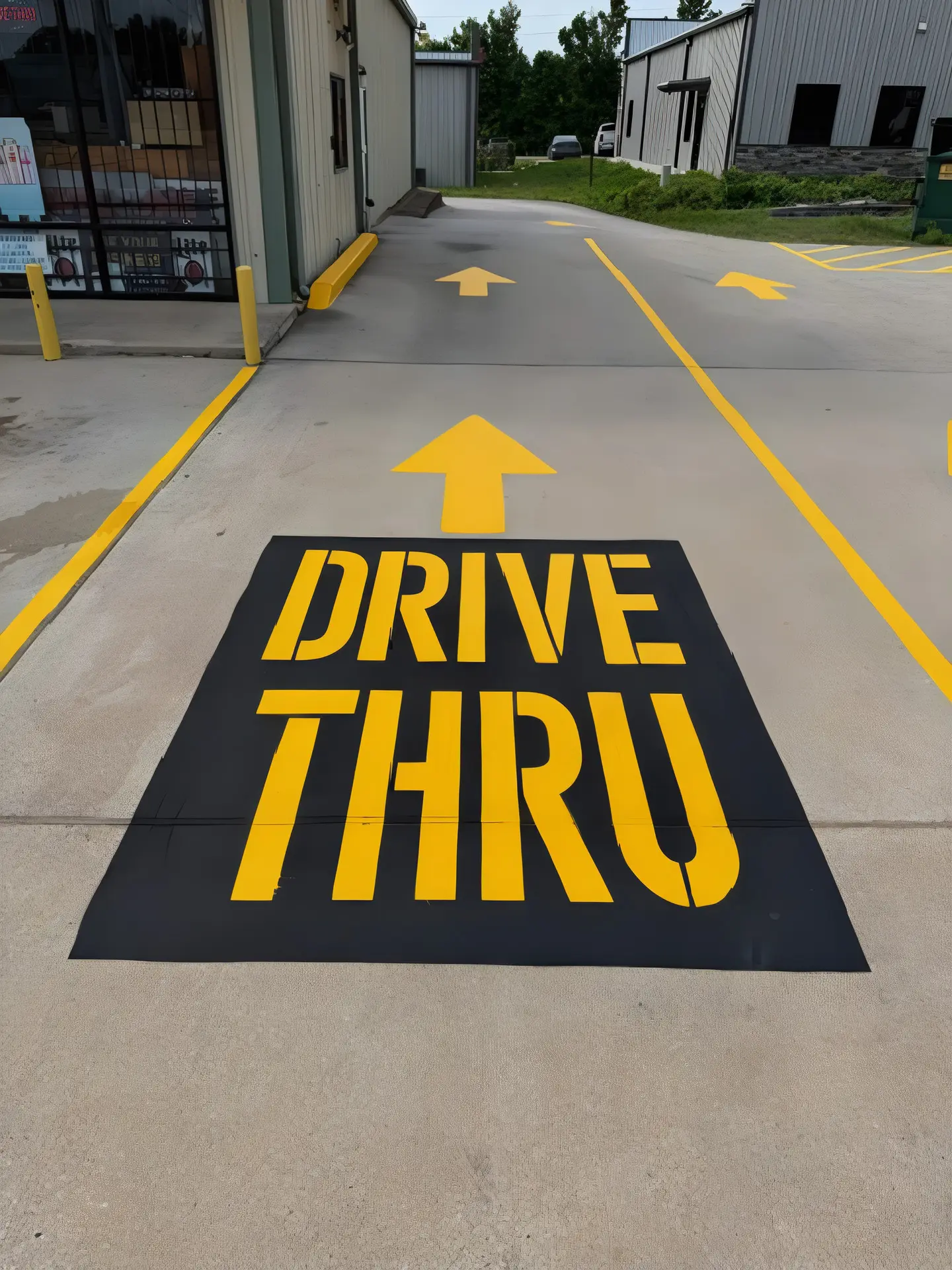 Drive-thru lane markings with directional arrows