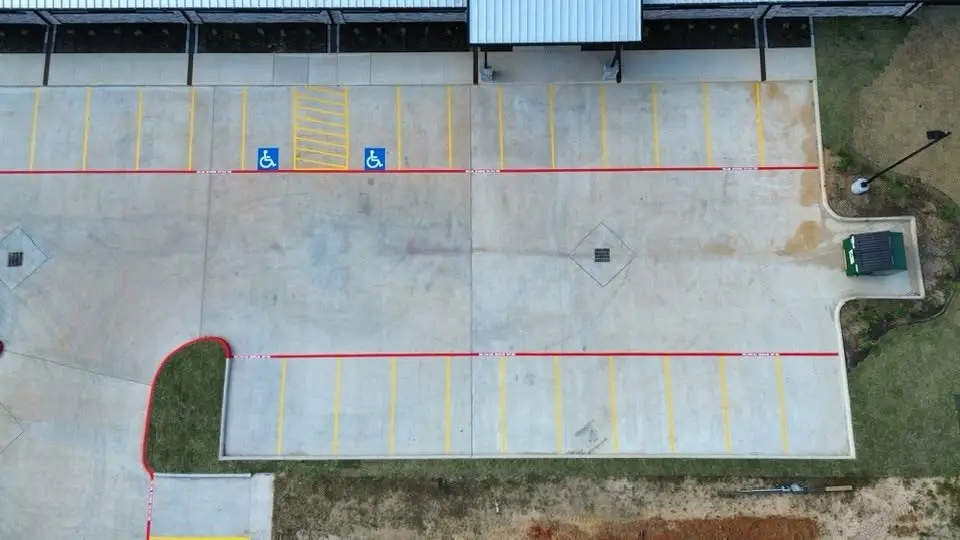 Commercial lot with new stalls, accessible parking, and fire lane
