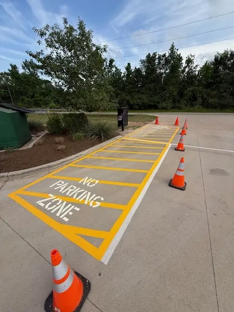 Hatched no-parking zone painted at dusk