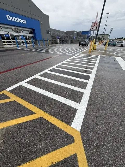 High-visibility crosswalk painted at a storefront